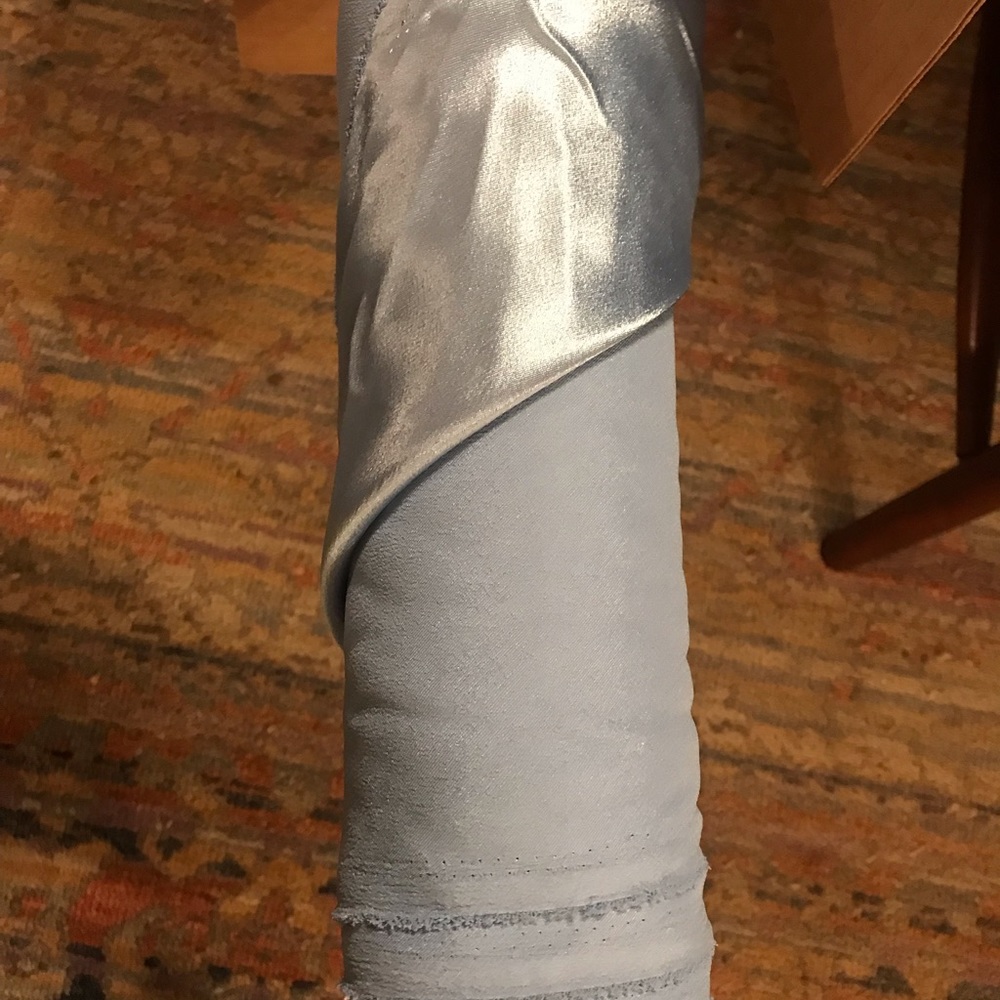 Lovely light blue satin material. “Heavy crepe back satin coppen”: fabric.com